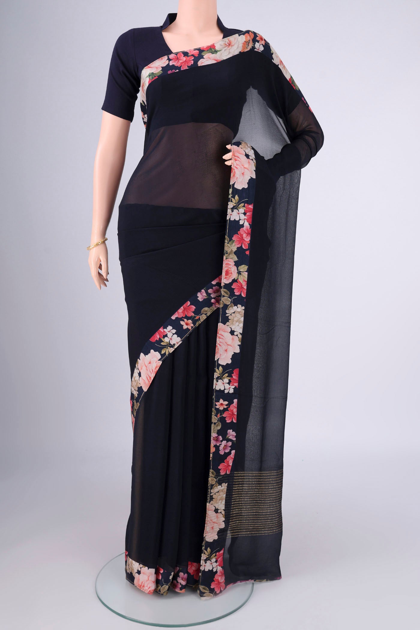 Navy Blue Mysore Chiffon Saree with Plain Body and Printed Border.  displayed on a mannequin