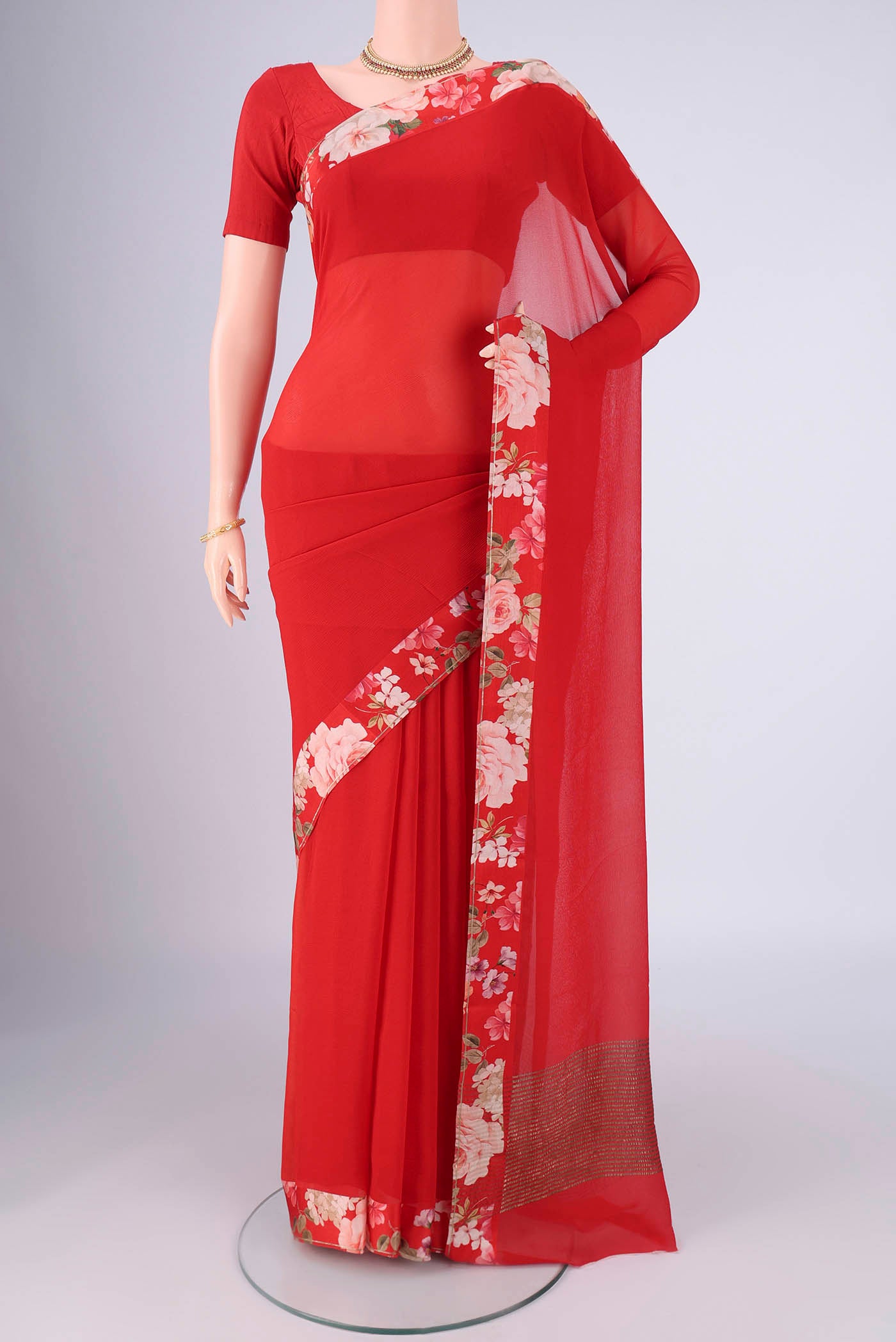 Red Mysore Chiffon Saree with Plain Body and Printed Border.  displayed on a mannequin