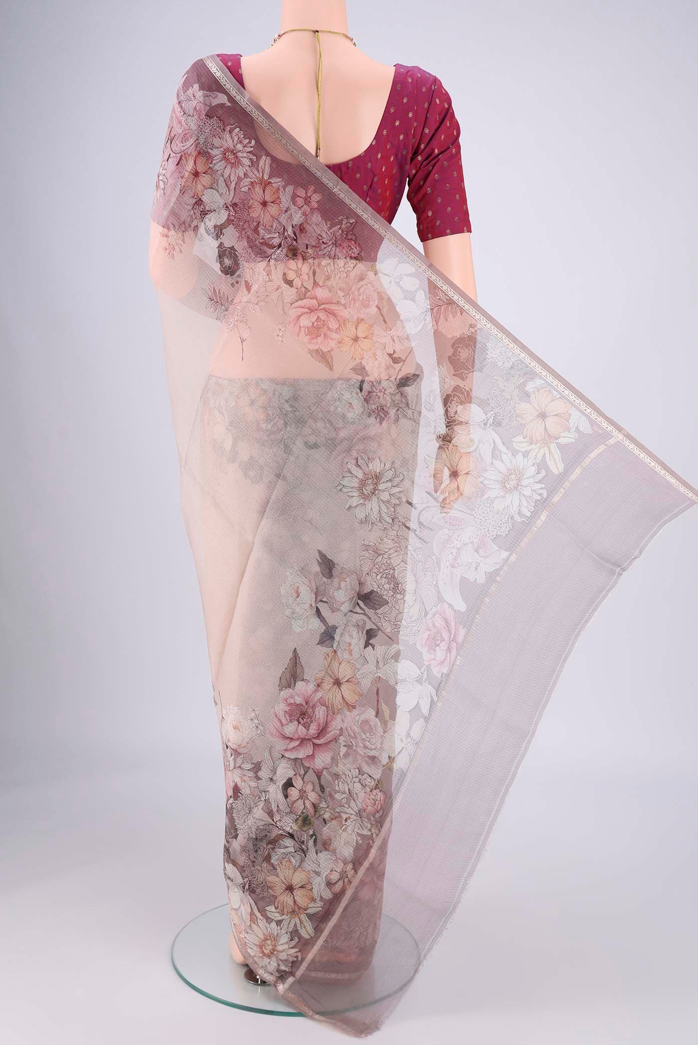 Flat view of Grey Kota Silk Saree with Floral Print on the body and Zari Border. 