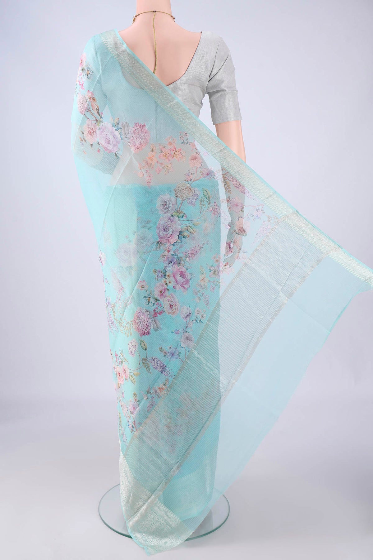 Flat view of Sky Blue Kota Silk Saree with Floral Print on the body and Zari Border. 
