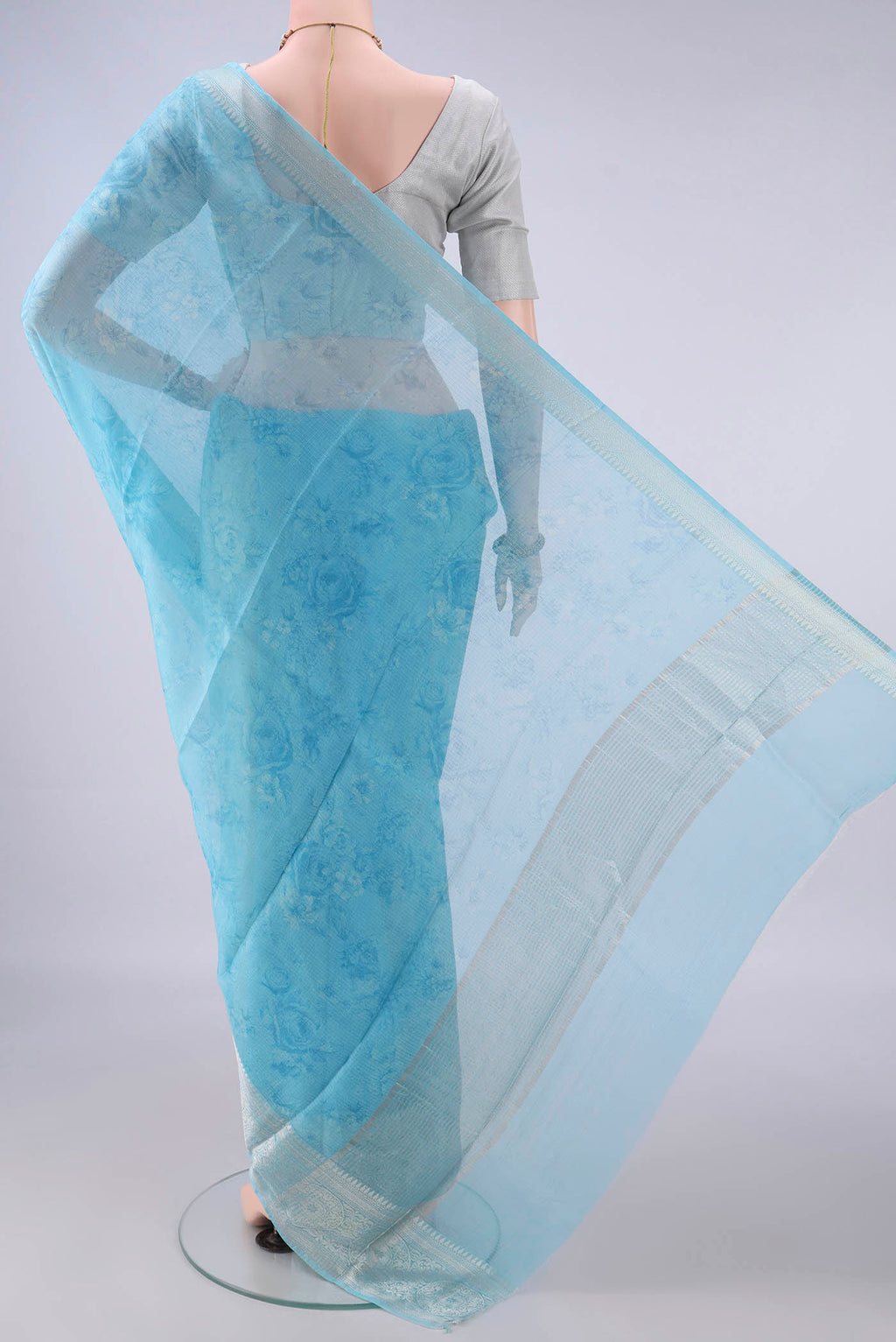 Flat view of Pure Silk Sky Blue Kota Saree with Floral Print on the body and Zari Border. 