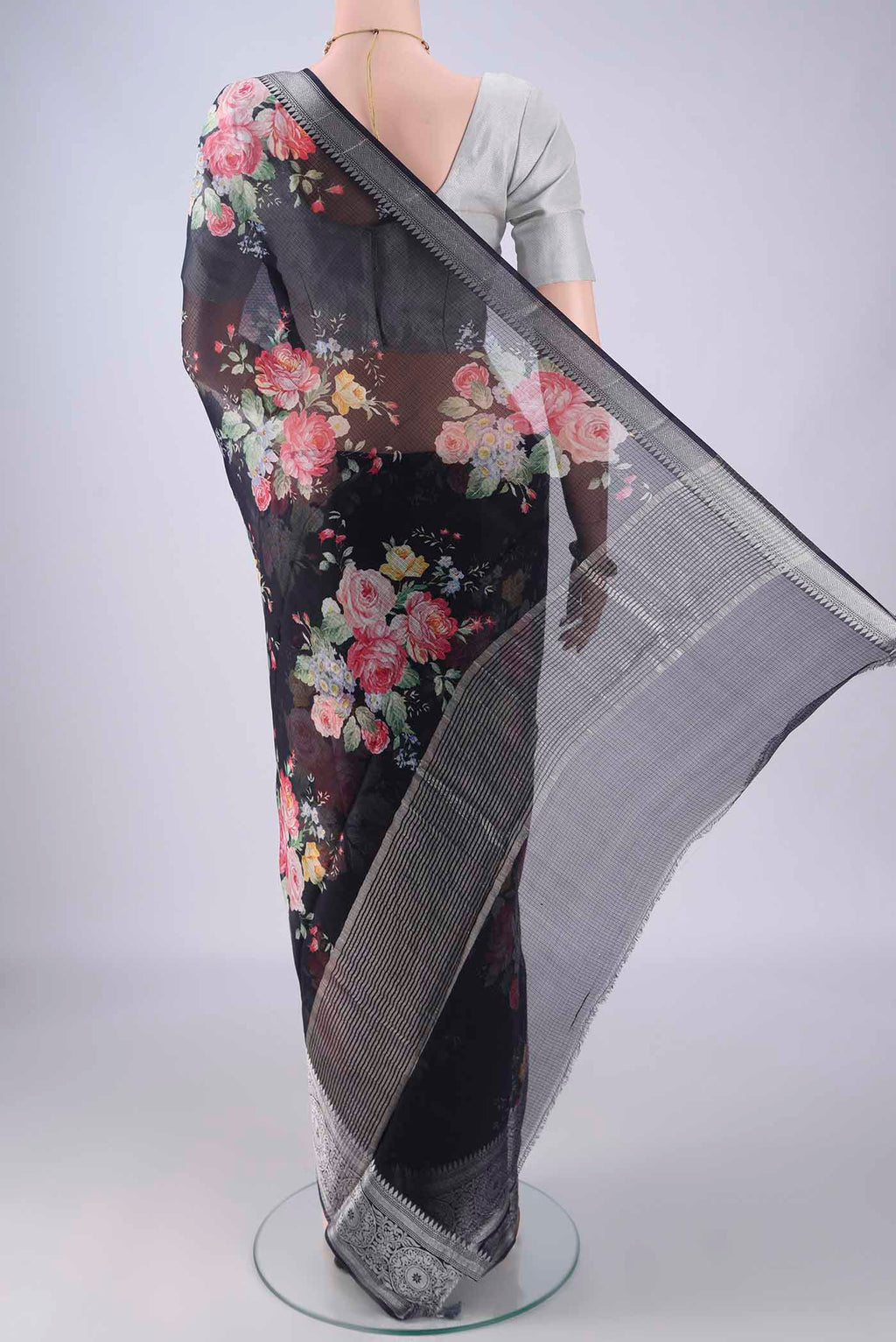 Flat view of Black Kota Silk Saree with Floral Print on the body and Zari Border. 