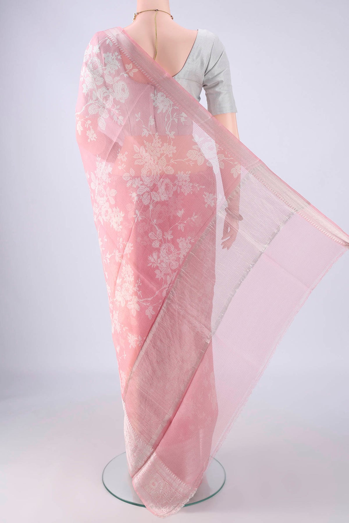Flat view of Pink Kota Silk Saree with Floral Print on the body and Zari Border. 