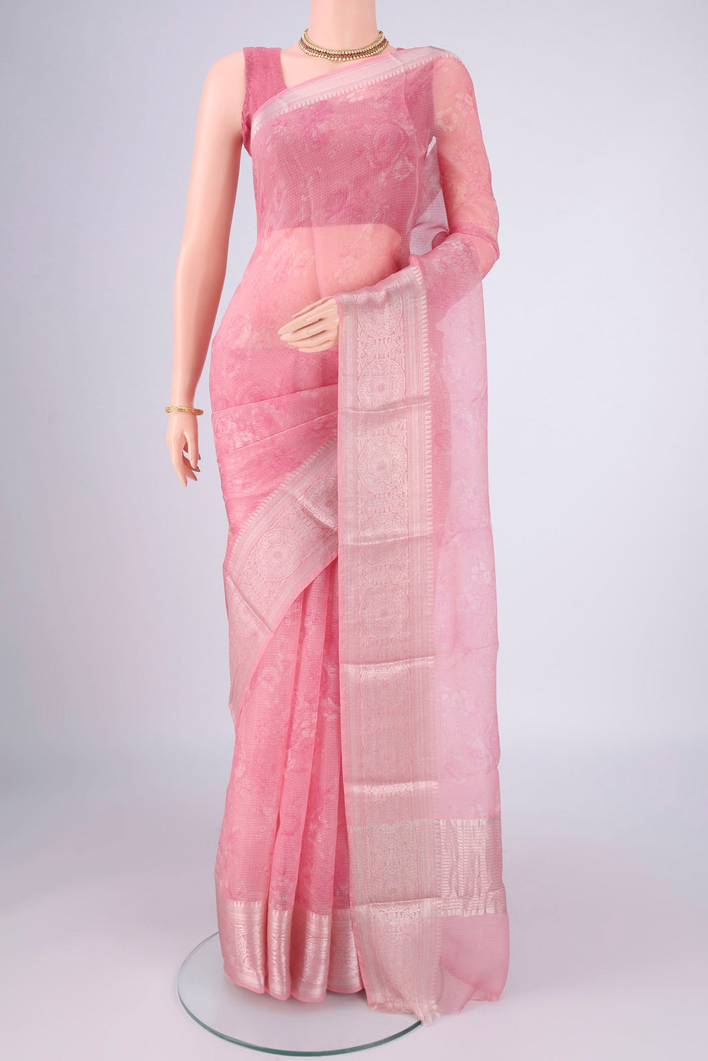 Rose pink Kota Silk Saree with Floral Print on the body and Zari Border.  displayed on a mannequin