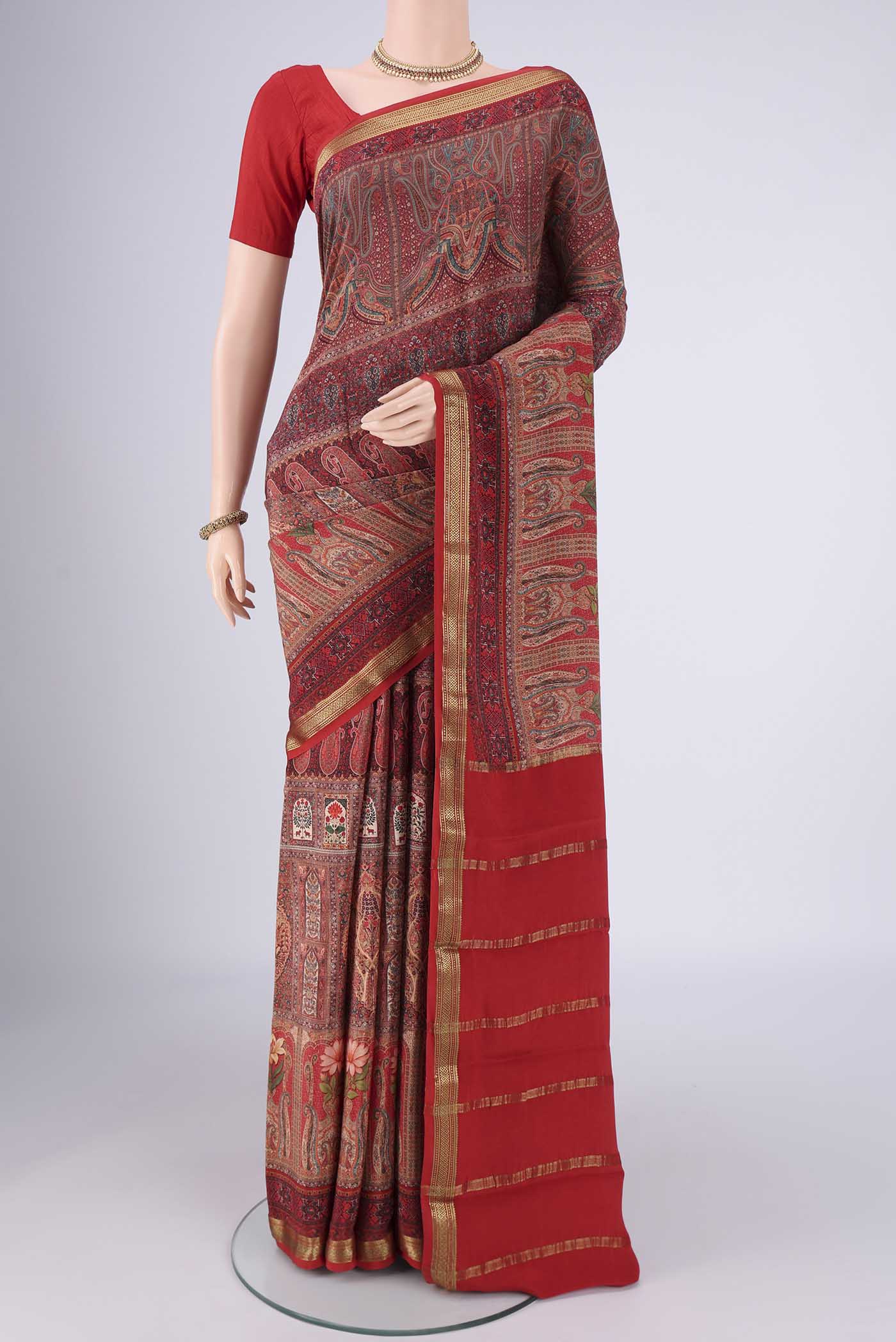 Multi Color Mysore Crepe Saree with Printed design on the body and Zari Border.  displayed on a mannequin