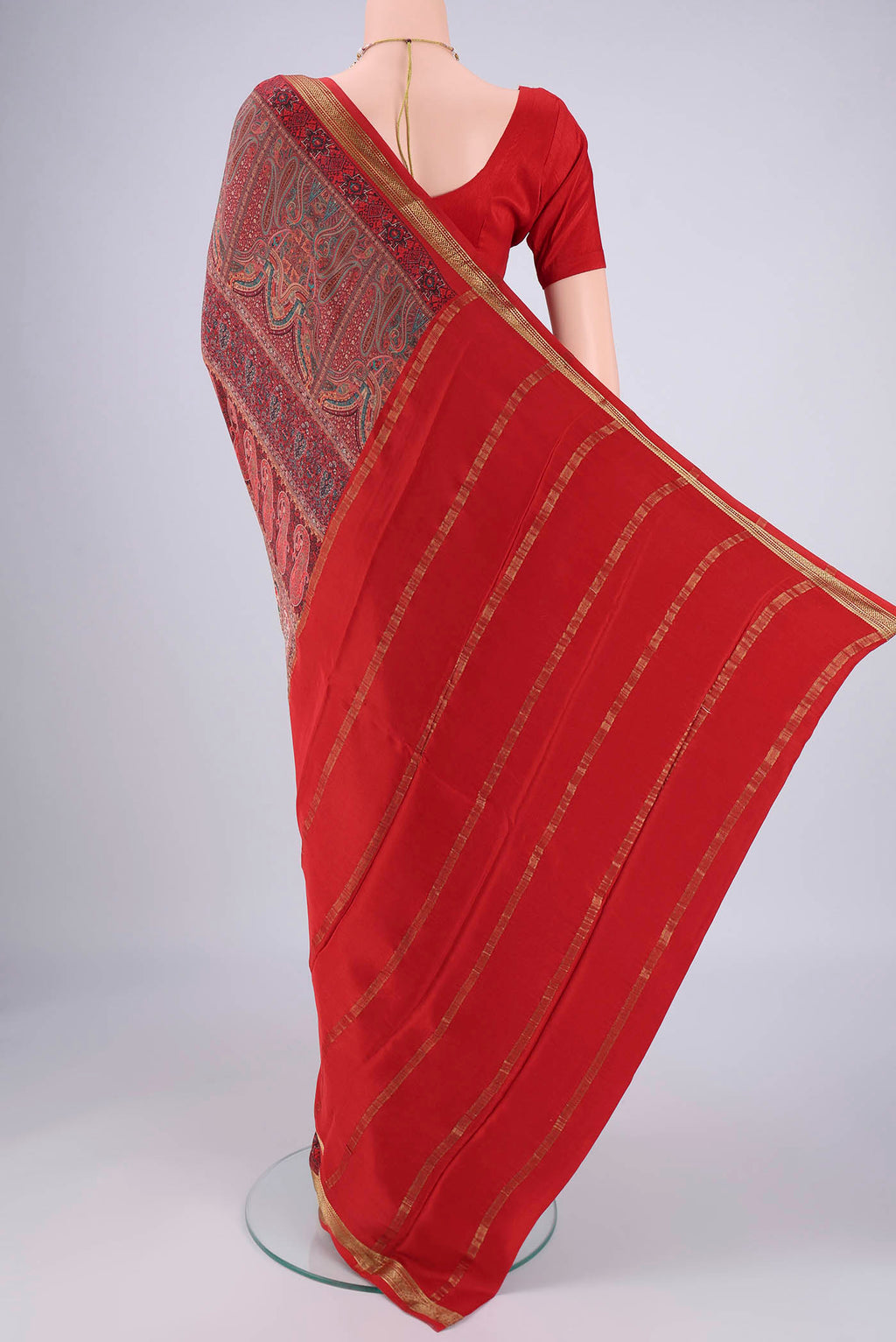Flat view of Multi Color Mysore Crepe Saree with Printed design on the body and Zari Border. 