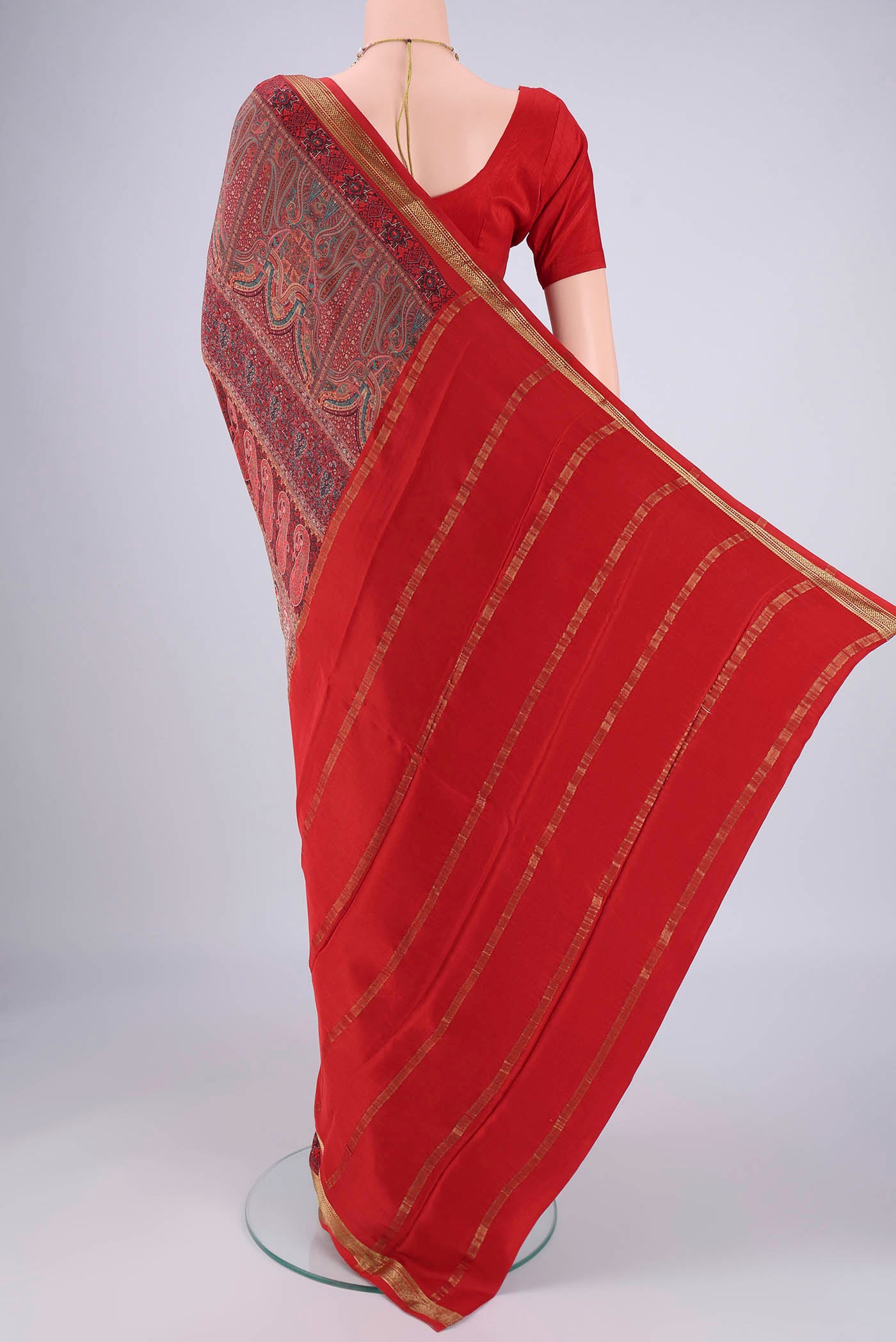 Flat view of Multi Color Mysore Crepe Saree with Printed design on the body and Zari Border. 