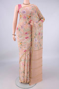 Peach Mysore Crepe Saree with Floral Print on the body and Zari Border.  displayed on a mannequin