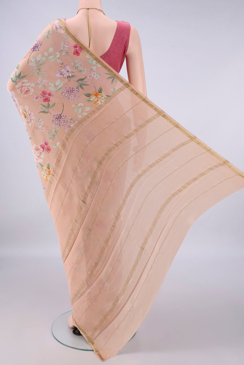 Flat view of Peach Mysore Crepe Saree with Floral Print on the body and Zari Border. 