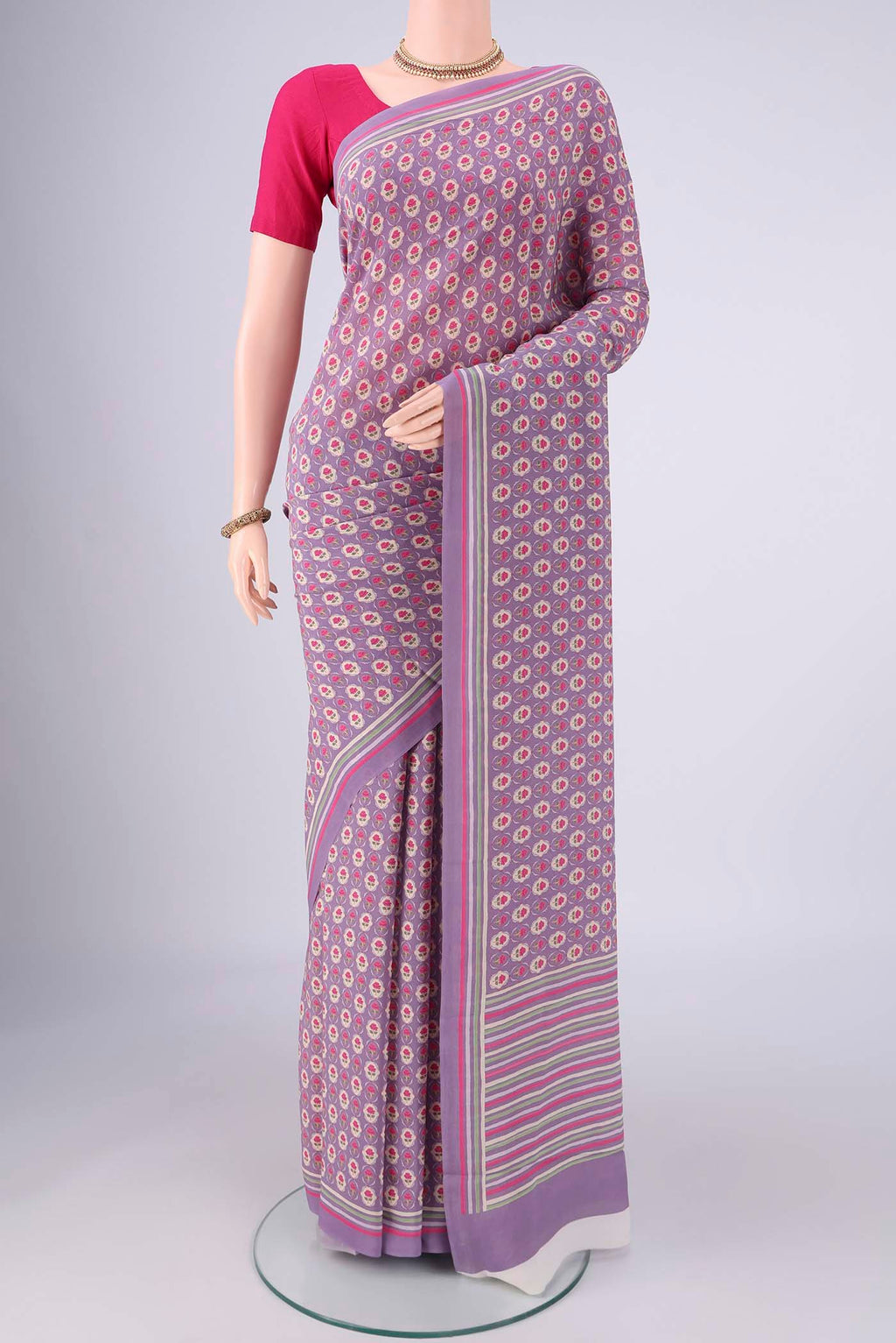Lavender Mysore Crepe Saree with Printed design on the body and Printed Border.  displayed on a mannequin