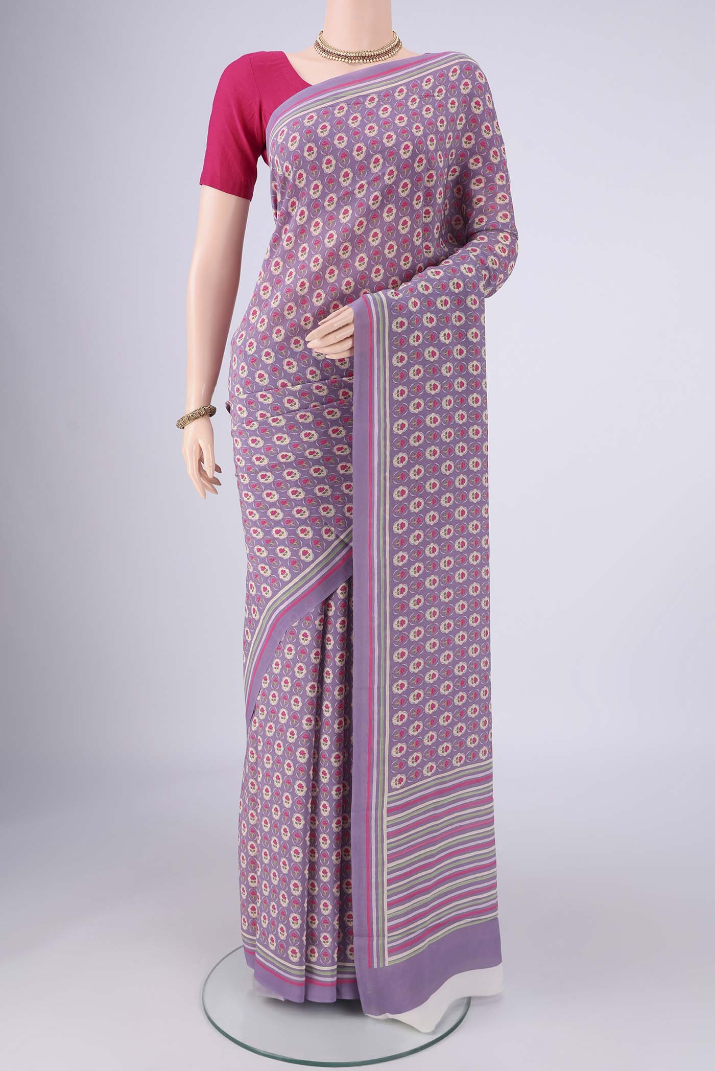 Lavender Mysore Crepe Saree with Printed design on the body and Printed Border.  displayed on a mannequin