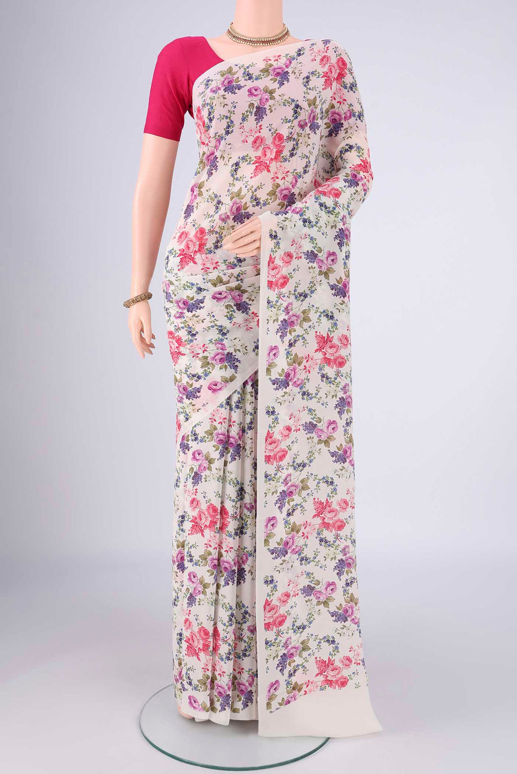 White Mysore Crepe Saree with Printed design on the body and Printed Border.  displayed on a mannequin