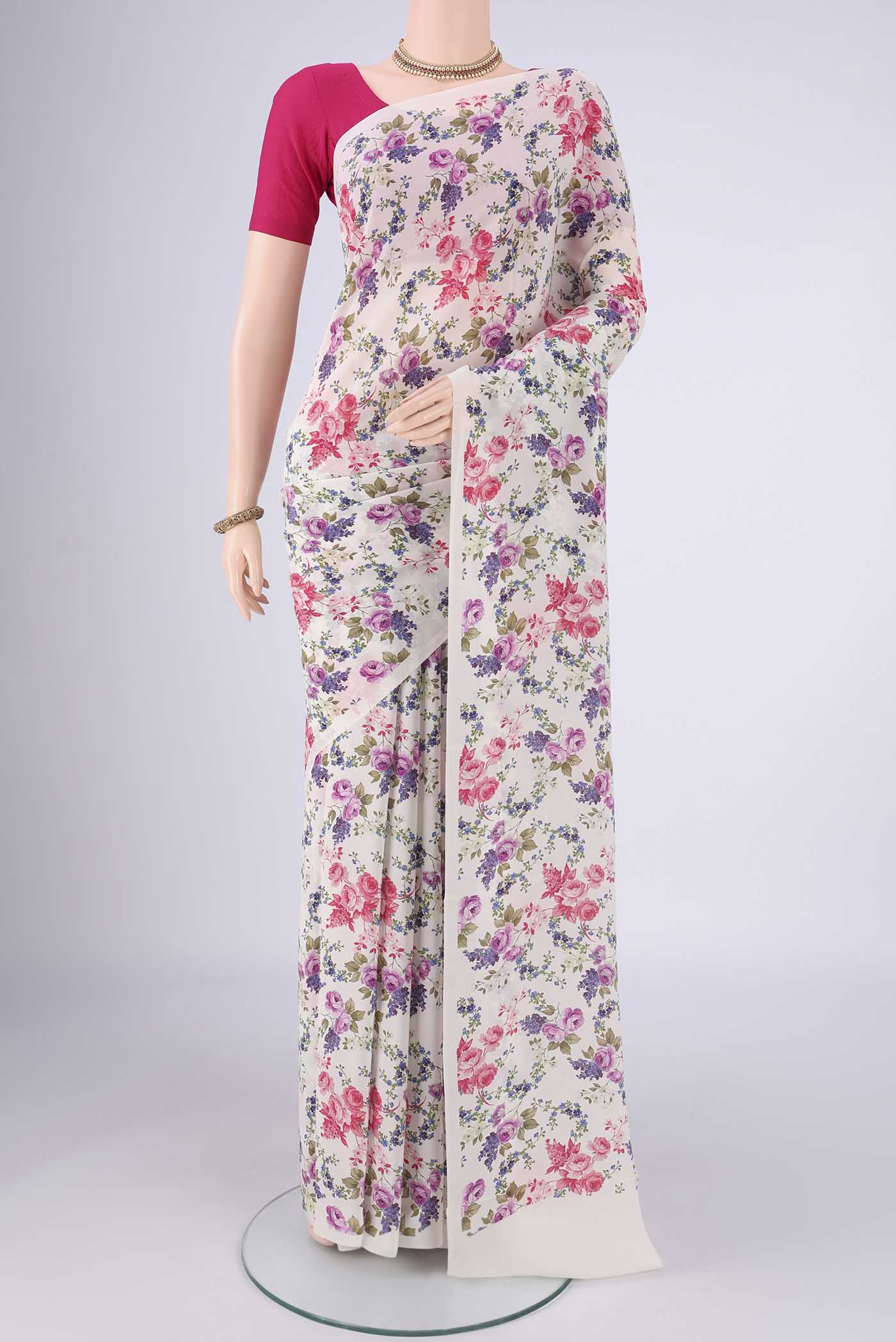 White Mysore Crepe Saree with Printed design on the body and Printed Border.  displayed on a mannequin