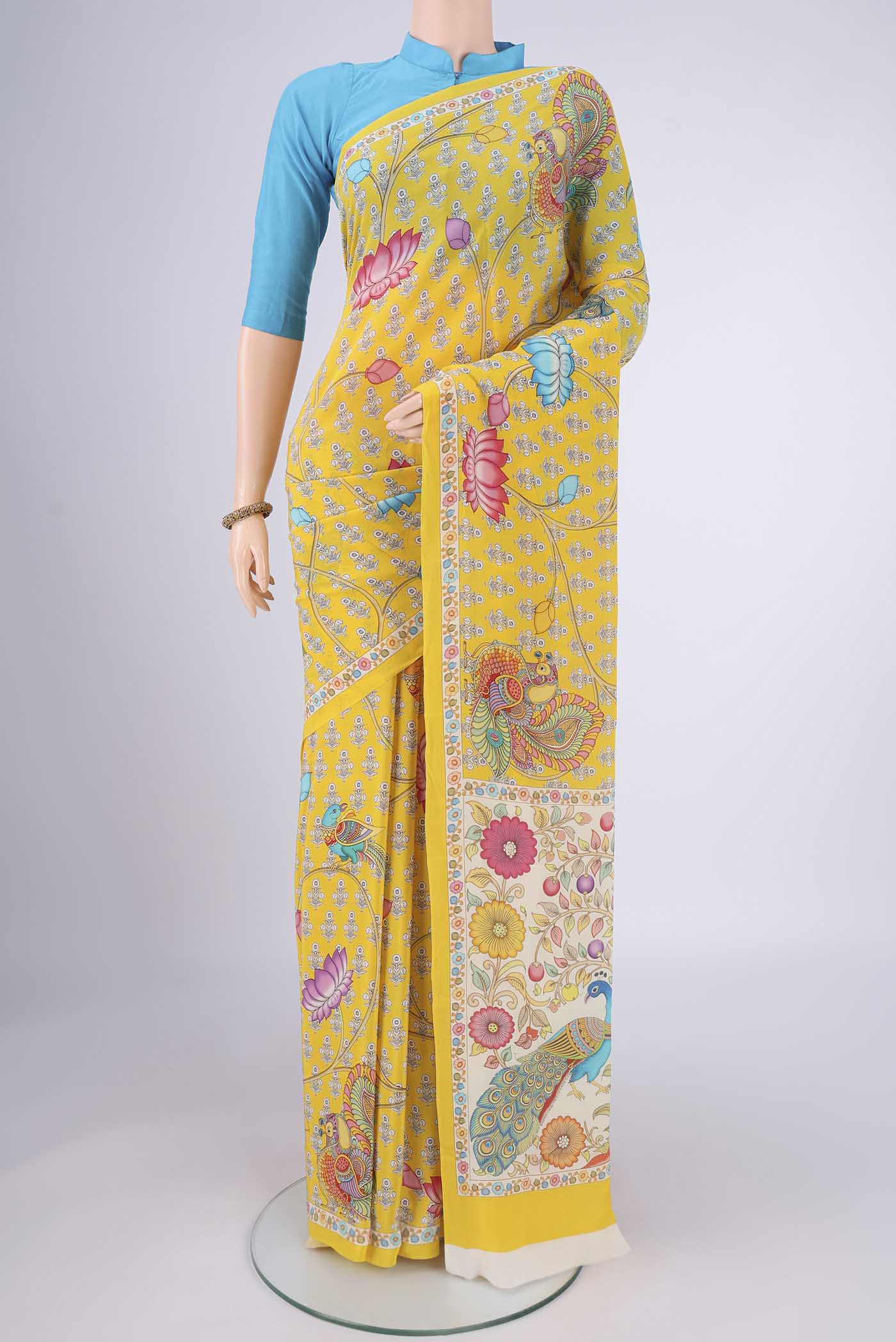 Yellow Mysore Crepe Saree with Printed design on the body and Printed Border.  displayed on a mannequin