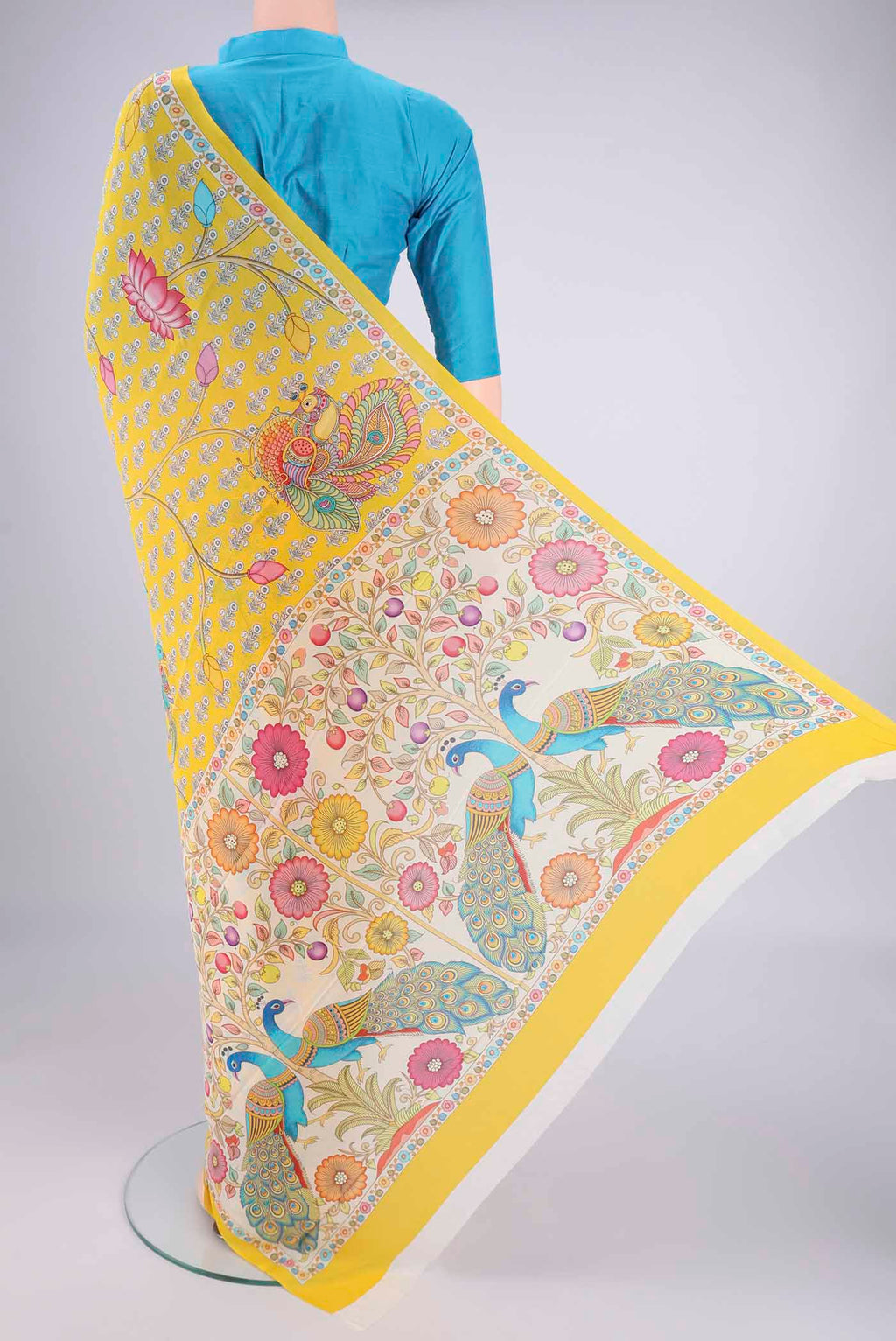 Flat view of Yellow Mysore Crepe Saree with Printed design on the body and Printed Border. 