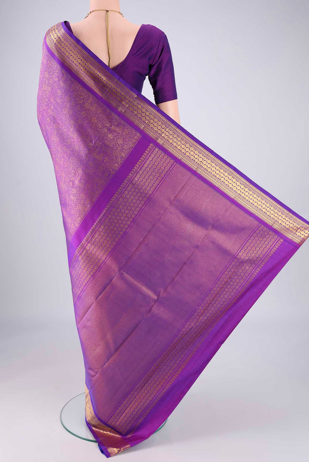 Flat view of Purple Kanjivaram Silk Saree with Zari Brocade on the body and Zari Border. 