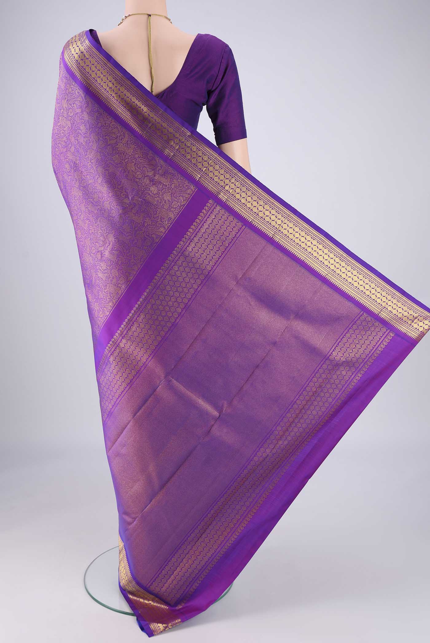 Flat view of Purple Kanjivaram Silk Saree with Zari Brocade on the body and Zari Border. 