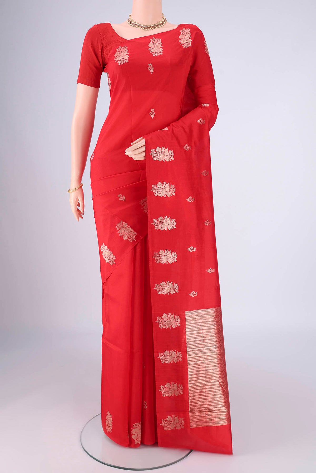 Red Banarasi Katan Silk Saree with Zari Butta on the body and Plain Border.  displayed on a mannequin