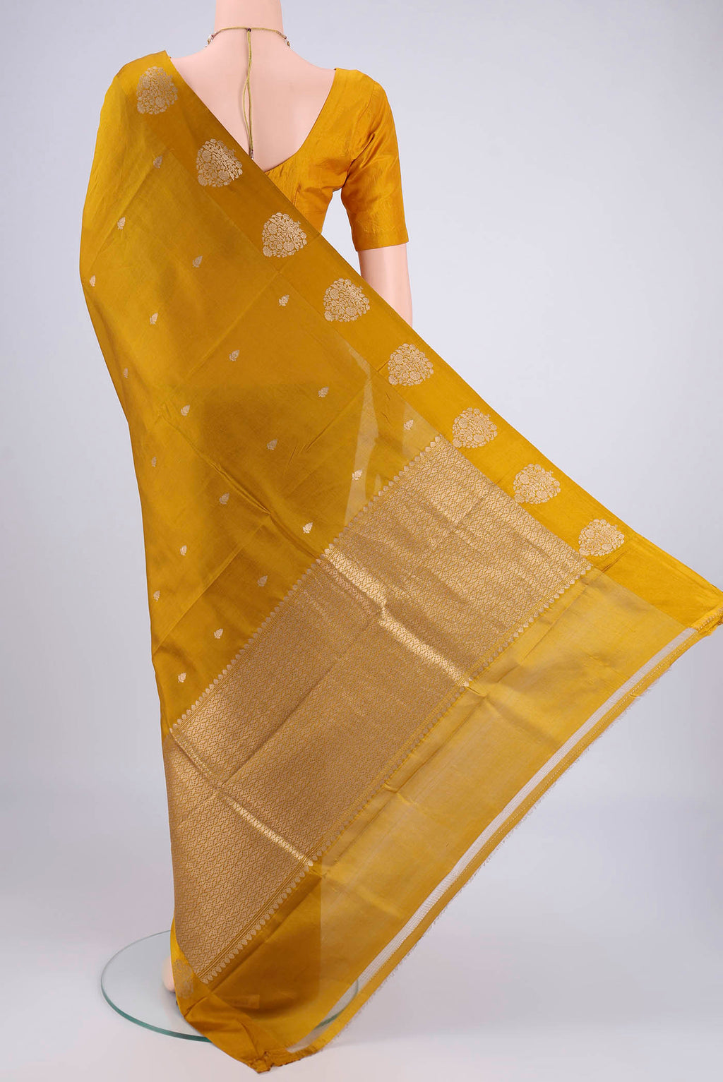 Flat view of Mehandi Green Banarasi Katan Silk Saree with Zari Butta on the body and Satin Border. 