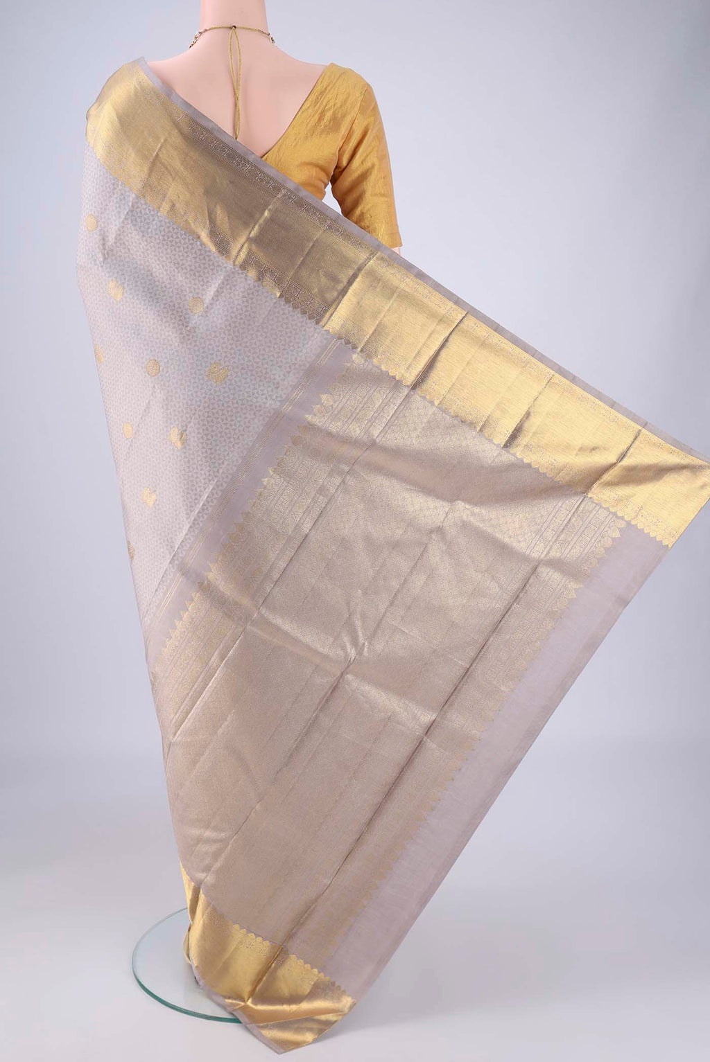Flat view of Grey Kanjivaram Silk Saree with Jacquard With Zari Butta on the body and Zari Border. 