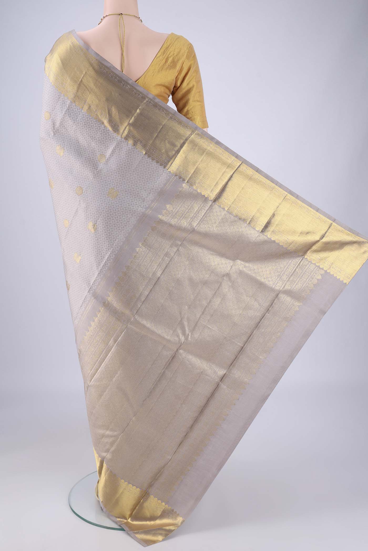 Flat view of Grey Kanjivaram Silk Saree with Jacquard With Zari Butta on the body and Zari Border. 