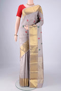 Grey Kanjivaram Silk Saree with Jacquard With Thread Butta on the body and Zari Border.  displayed on a mannequin