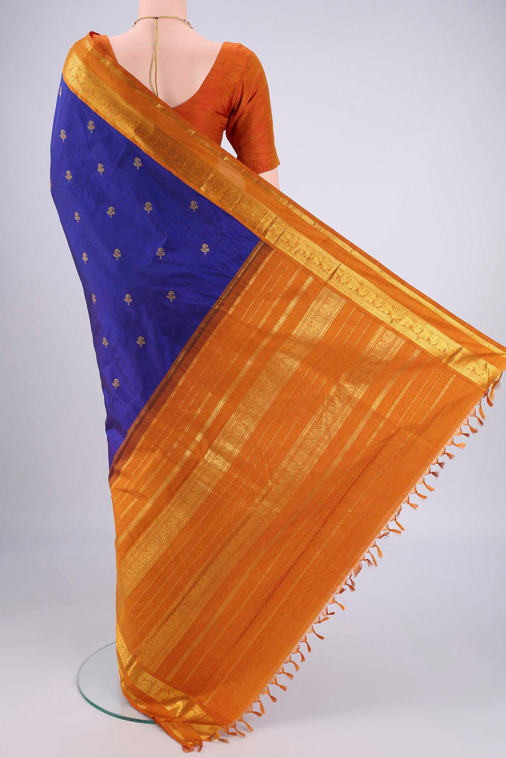 Flat view of Blue Kanjivaram Silk Saree with Zari Butta on the body and Zari Border. 