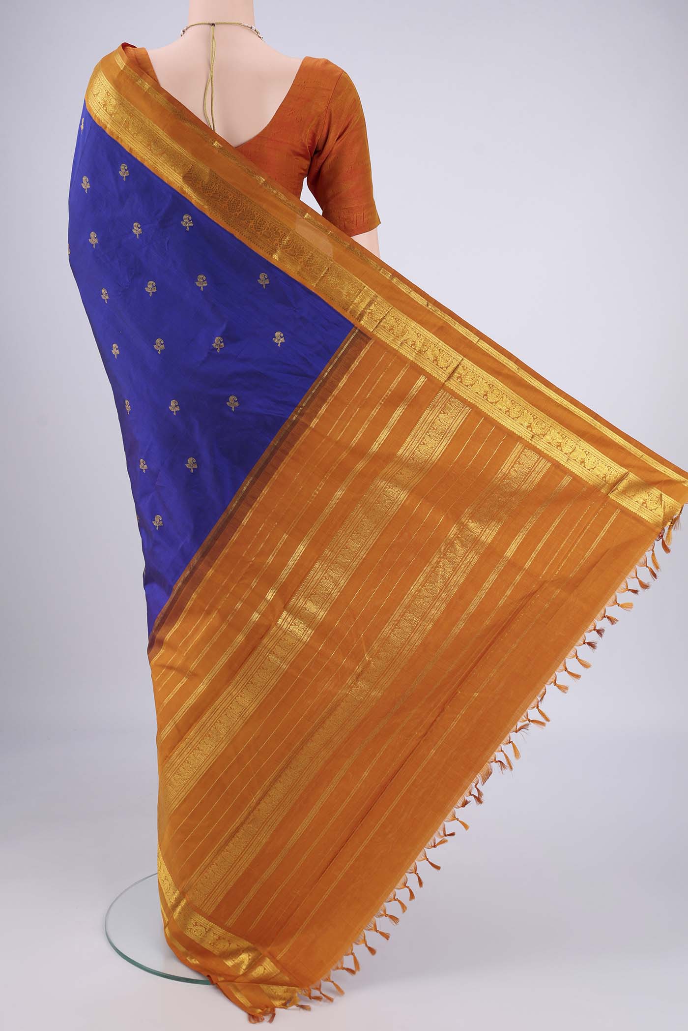 Flat view of Blue Kanjivaram Silk Saree with Zari Butta on the body and Zari Border. 