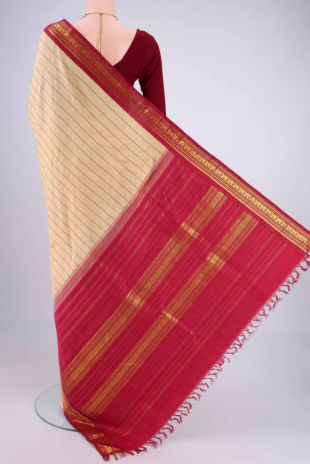 Flat view of Beige Kanchipuram Silk Saree with Veldhari on the body and Zari Border. 