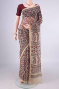 Beige Kota Cotton Saree with Ajrakh Print on the body and Zari Border.  displayed on a mannequin