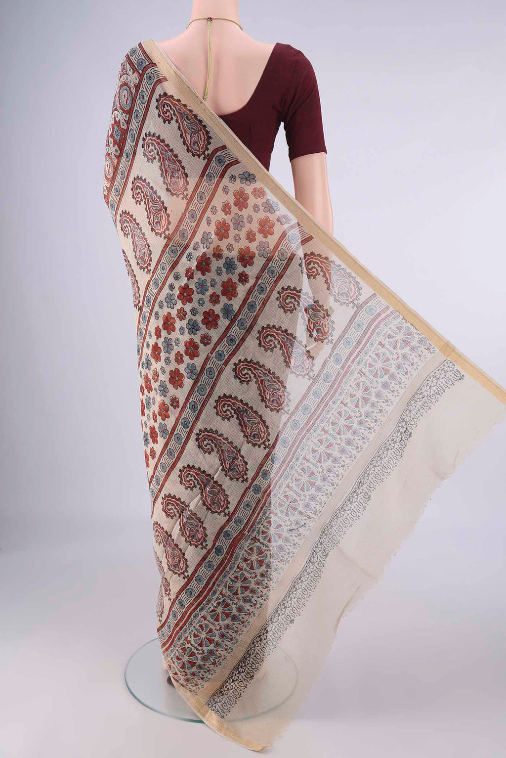 Flat view of Beige Kota Cotton Saree with Ajrakh Print on the body and Zari Border. 