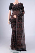 Black Kota Cotton Saree with Ajrakh Print on the body and Zari Border.  displayed on a mannequin
