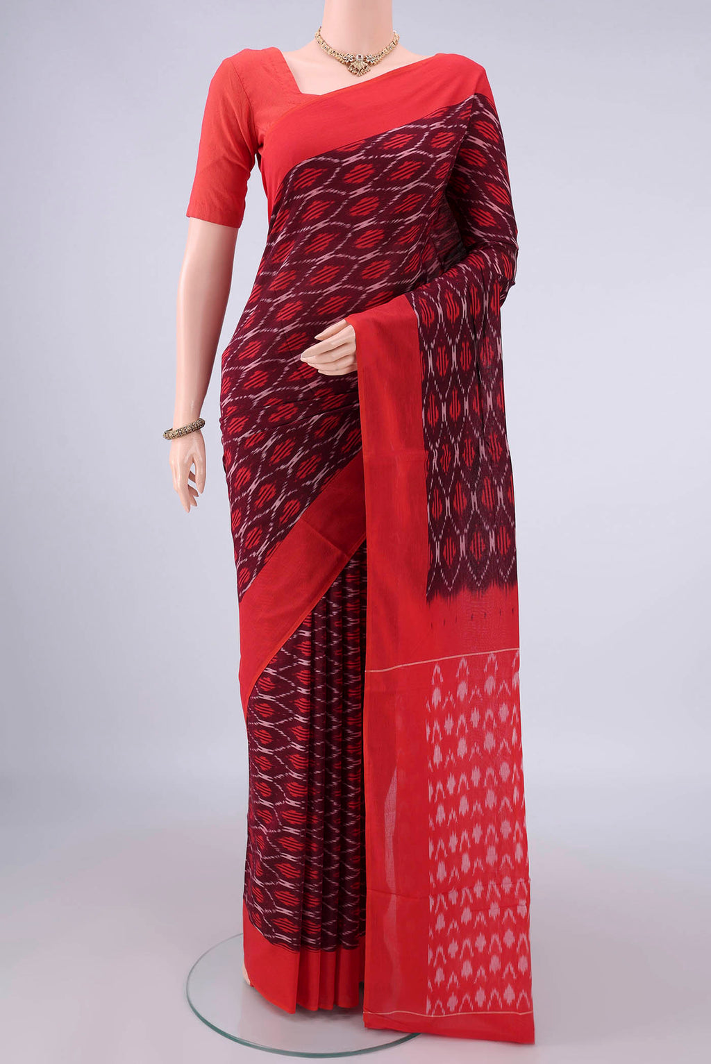Purple Pochampally Cotton Saree with Ikat design on the body and Ikat Border.  displayed on a mannequin