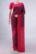 Magenta Pochampally Cotton Saree with Ikat design on the body and Ikat Border.  displayed on a mannequin