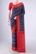Navy Blue Pochampally Cotton Saree with Ikat design on the body and Ikat Border.  displayed on a mannequin