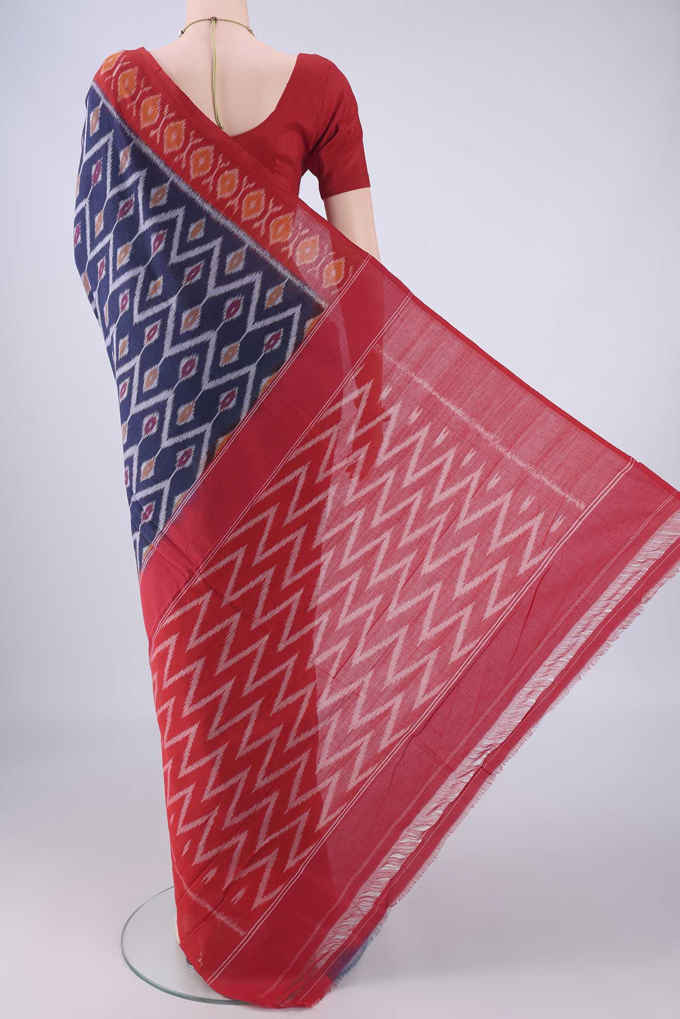 Flat view of Navy Blue Pochampally Cotton Saree with Ikat design on the body and Ikat Border. 