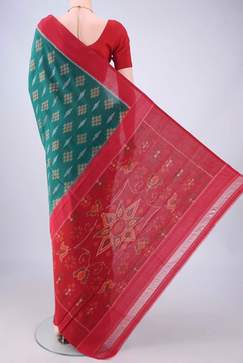 Flat view of Green Pochampally Cotton Saree with Ikat design on the body and Plain Border. 