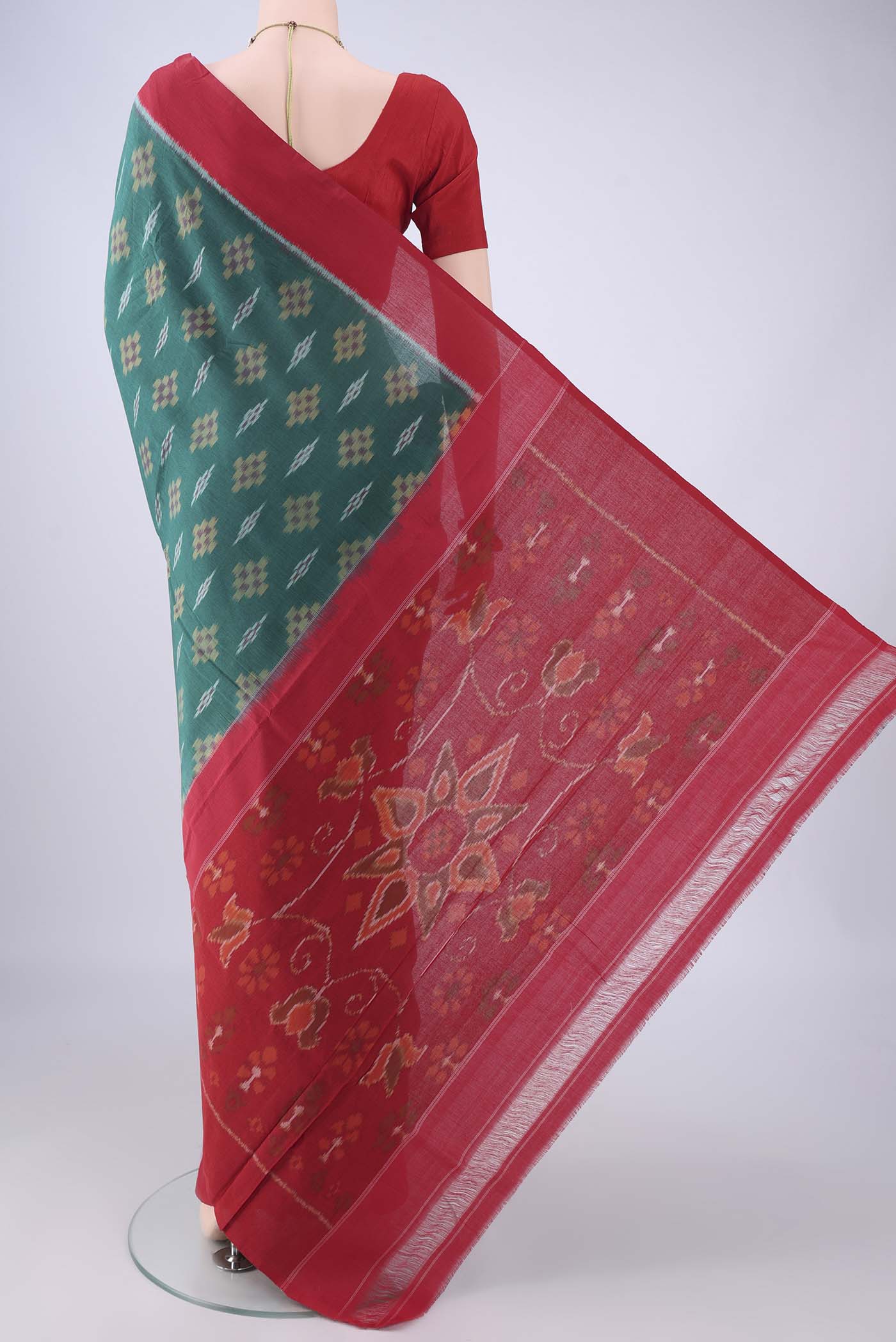 Flat view of Green Pochampally Cotton Saree with Ikat design on the body and Plain Border. 