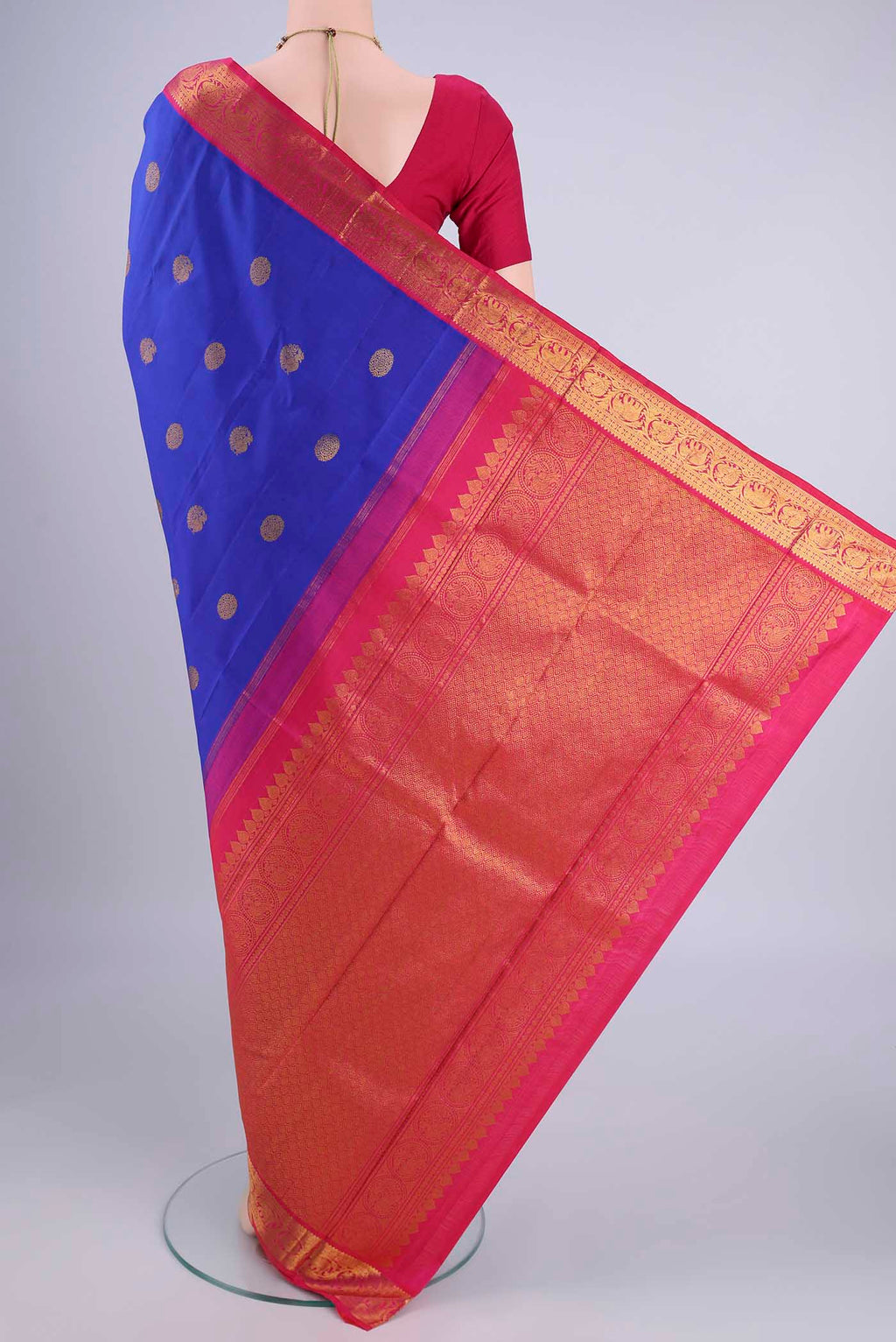 Flat view of Royal Blue Kanjivaram Silk Saree with Zari Butta on the body and Zari Border. 