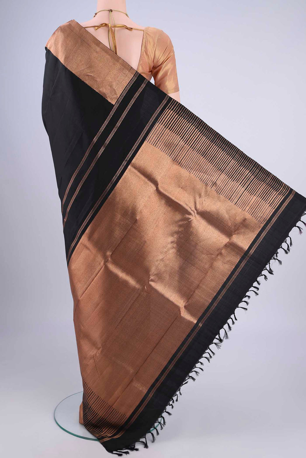 Flat view of Black Kanjivaram Silk Saree with Plain Body and Zari Border. 