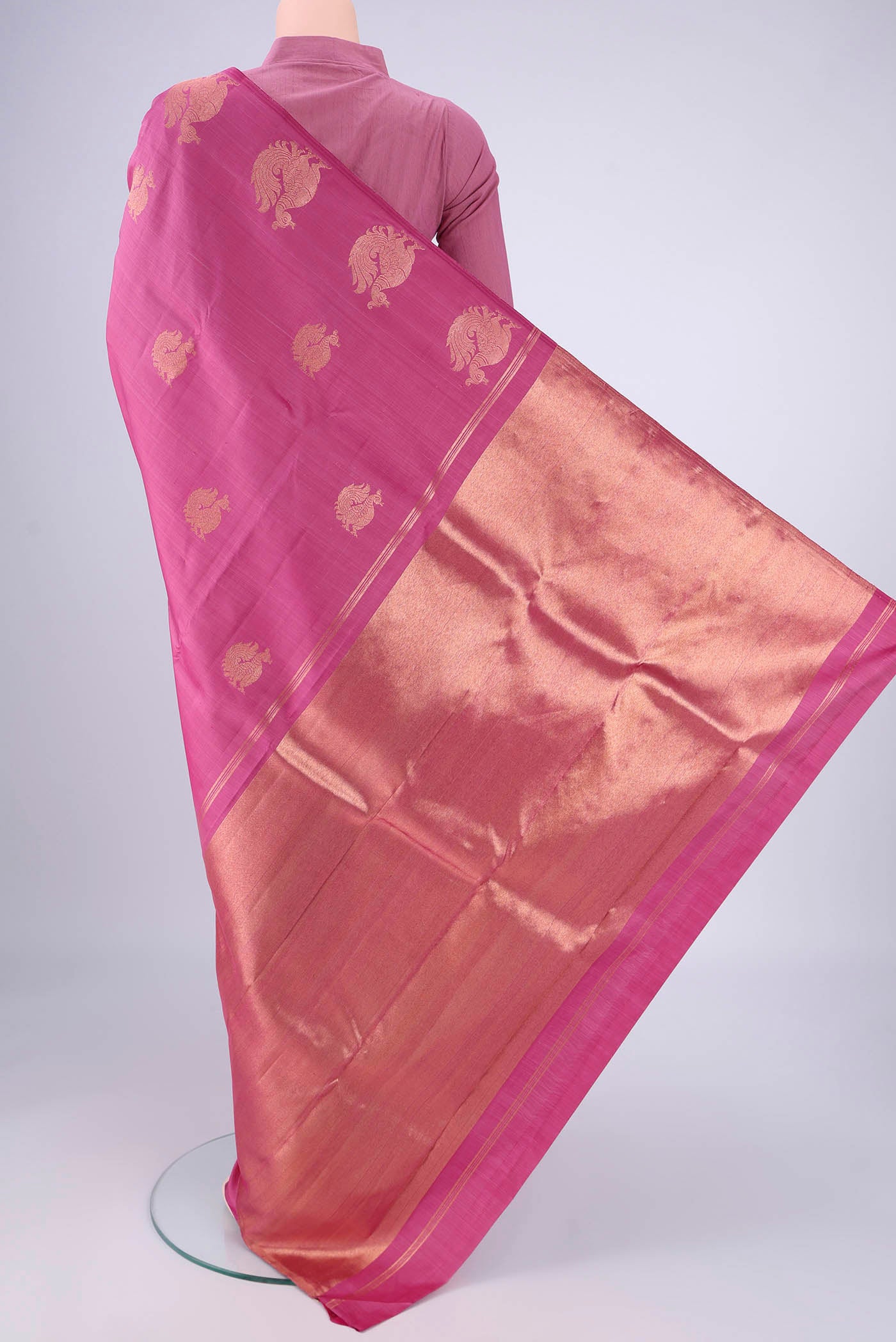 Flat view of Pink Kanchipuram Silk Saree with Zari Butta on the body and Without Border. 