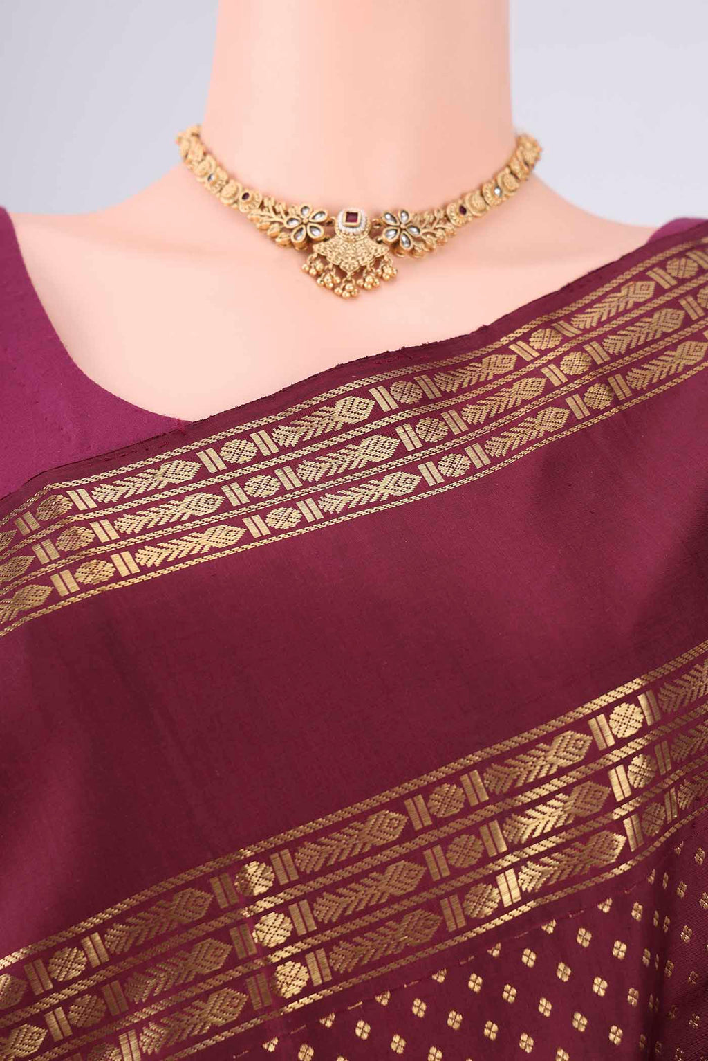 Border image of Pure Silk Pure Zari Maroon Kanjivaram Saree with Zari Butta on the body and Zari Border. 