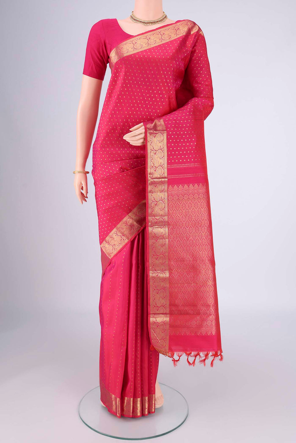 Dark Pink Dual Tone Kanjivaram Silk Saree with Zari Butta on the body and Zari Border.  displayed on a mannequin