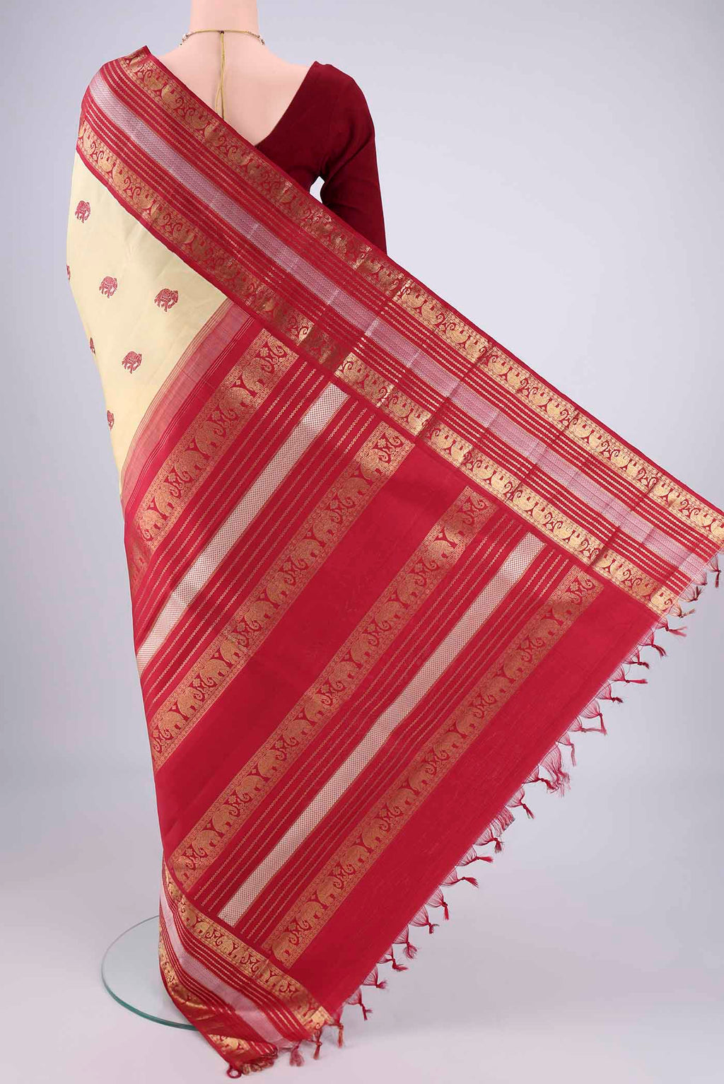 Flat view of Sandal Kanchipuram Silk Saree with Thread Butta on the body and Zari Border. 