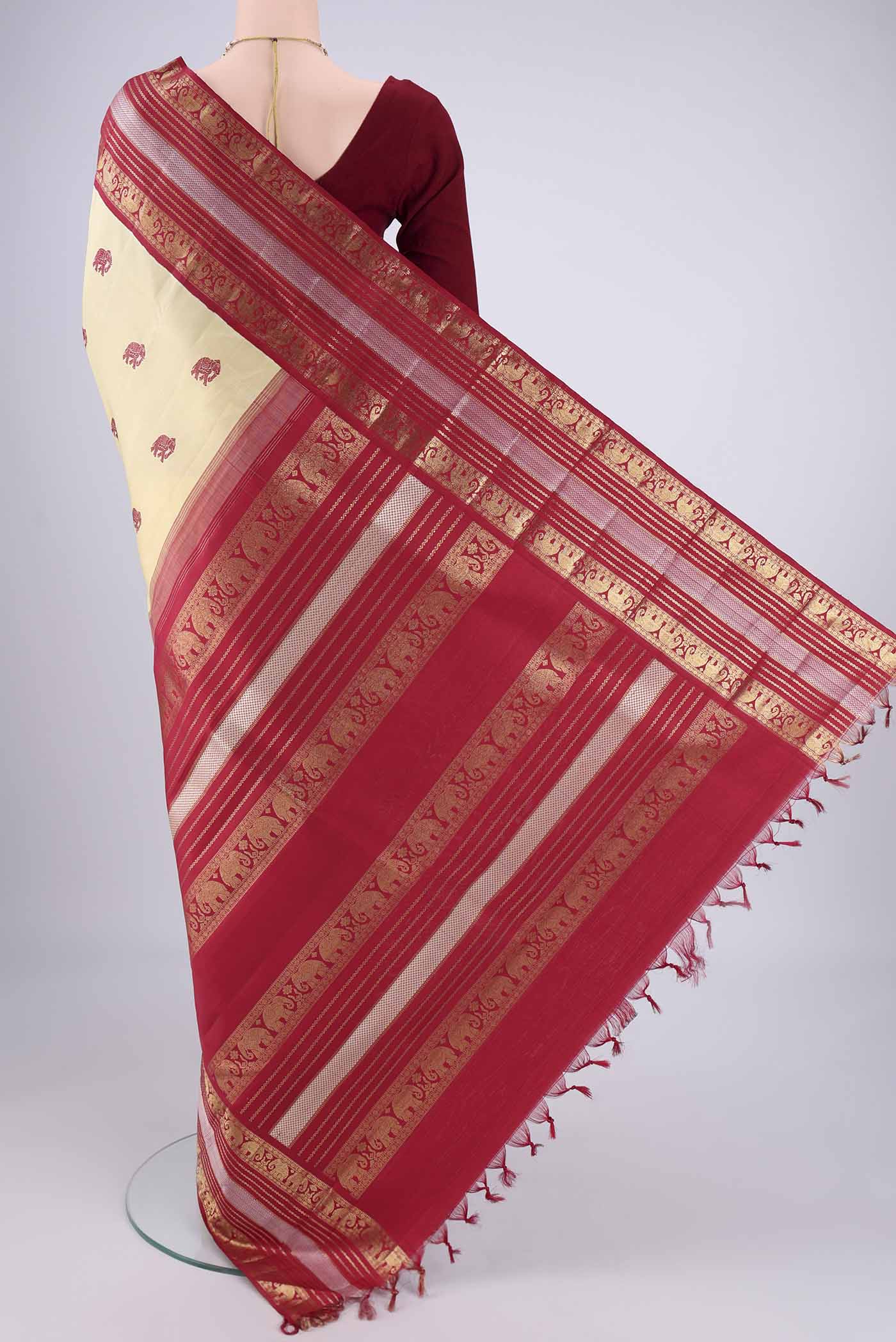 Flat view of Sandal Kanchipuram Silk Saree with Thread Butta on the body and Zari Border. 