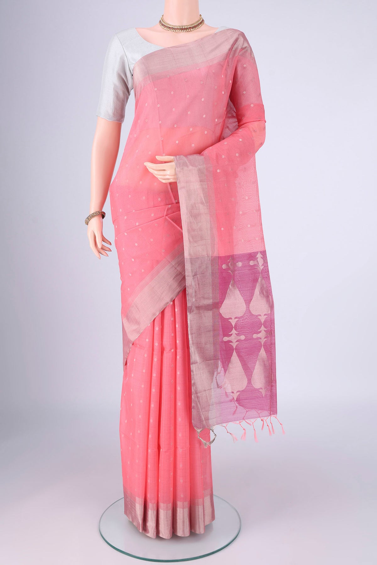 Rose pink Silk Cotton Saree with Zari Butta on the body and Zari Border.  displayed on a mannequin