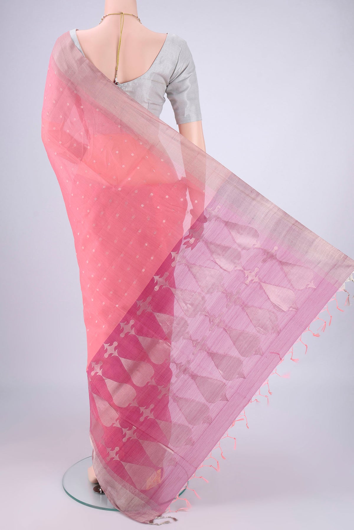 Flat view of Rose pink Silk Cotton Saree with Zari Butta on the body and Zari Border. 