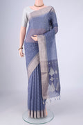 Lilac Silk Cotton Saree with Zari Butta on the body and Zari Border.  displayed on a mannequin