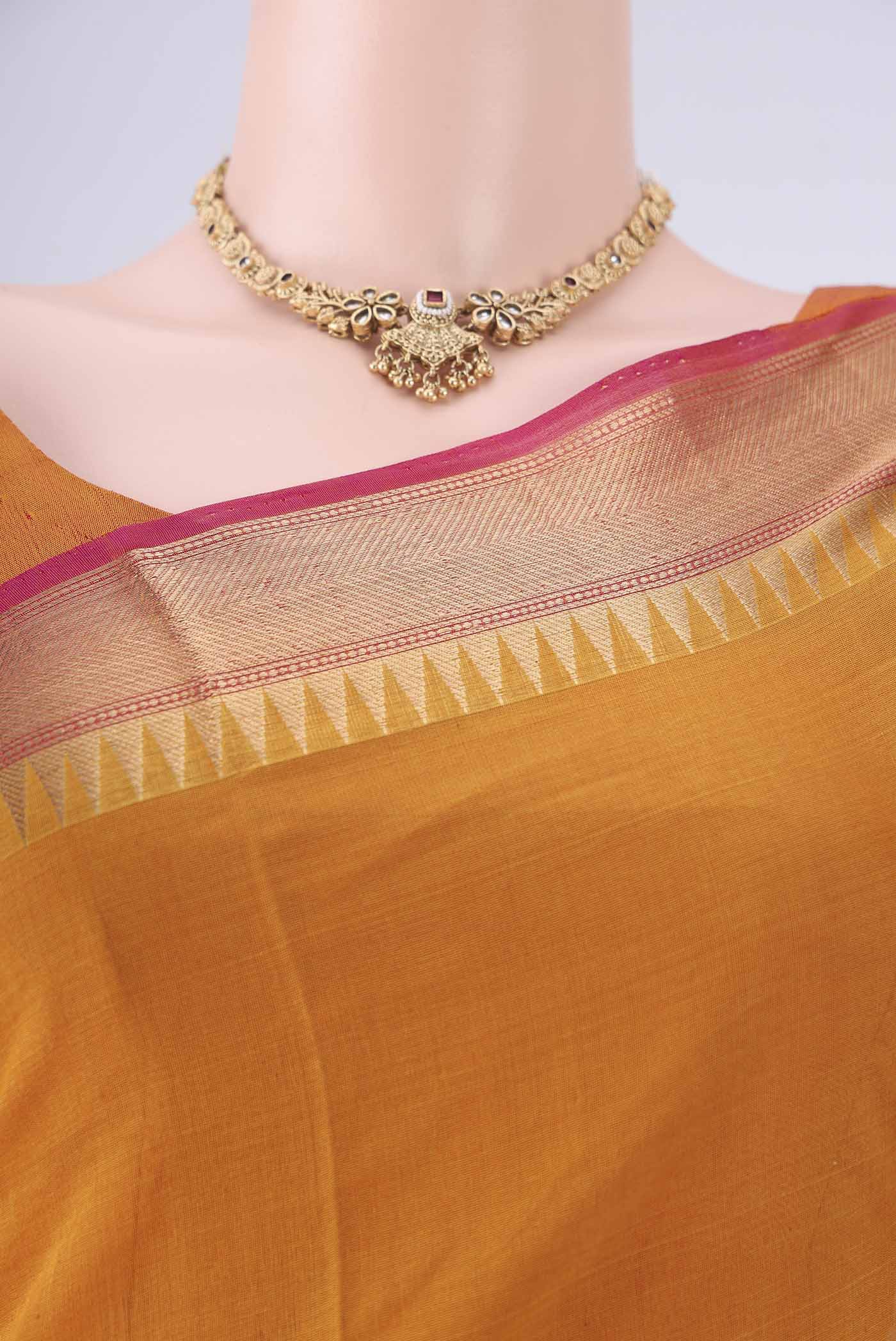 Border image of Mustard Kora Cotton Saree with Zari Butta on the body and Zari Border. 