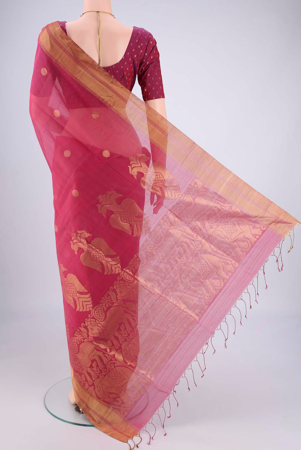 Flat view of Pink Silk Cotton Saree with Zari Butta on the body and Zari Border. 